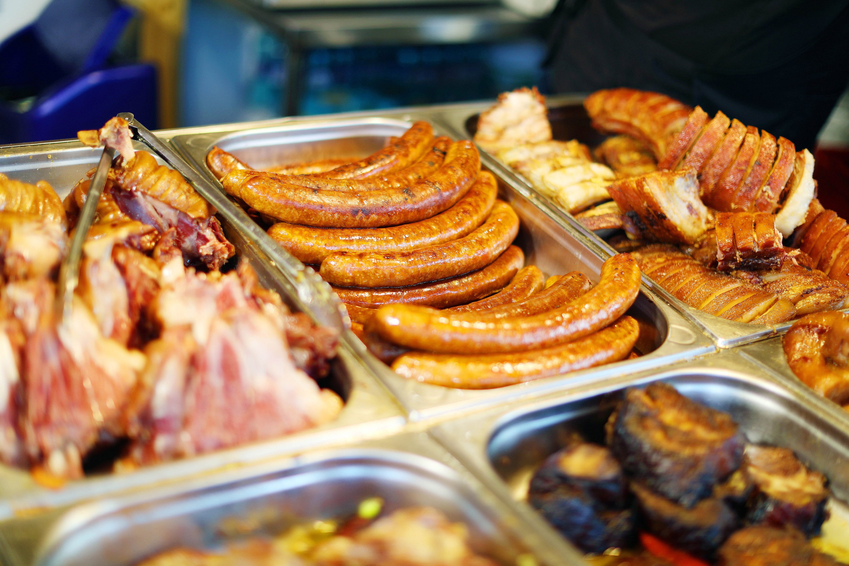 Grilled sausages and meat products at street food fair